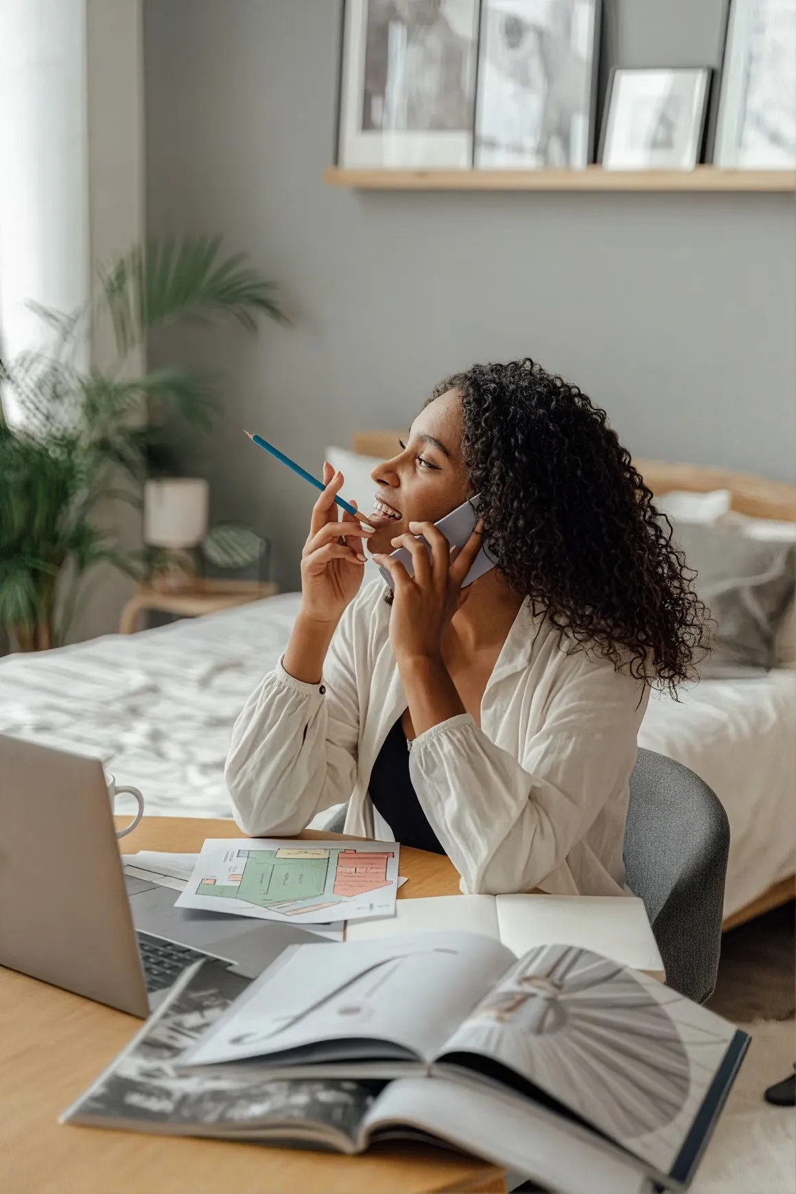 A woman on the phone with her counselor from home